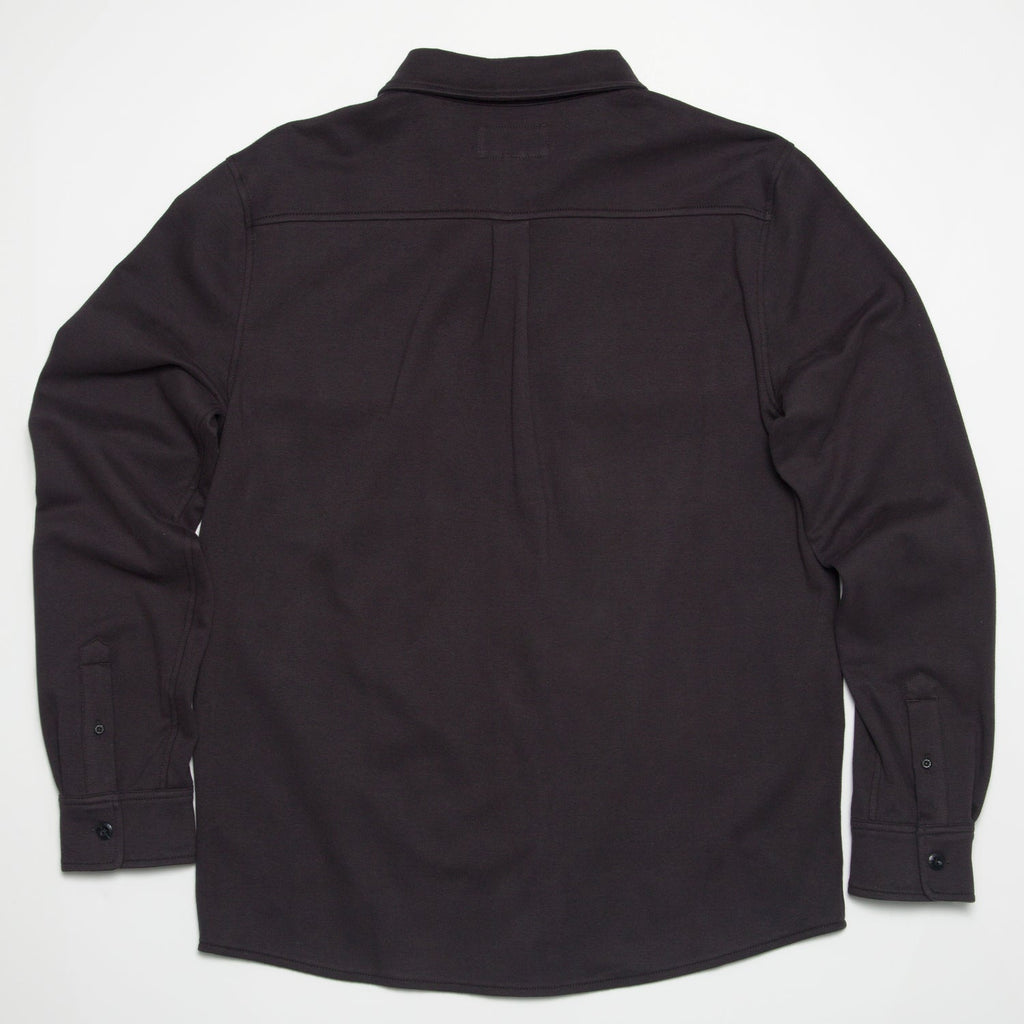 Raymond Ls Shirt showing back view in dark color, surf-inspired comfort apparel designed for beach and active lifestyles.
