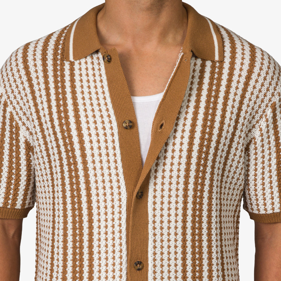 Close-up of the front chest and collar of the Cabana Knit Sweater in brown and white knit pattern, beach-inspired comfort.