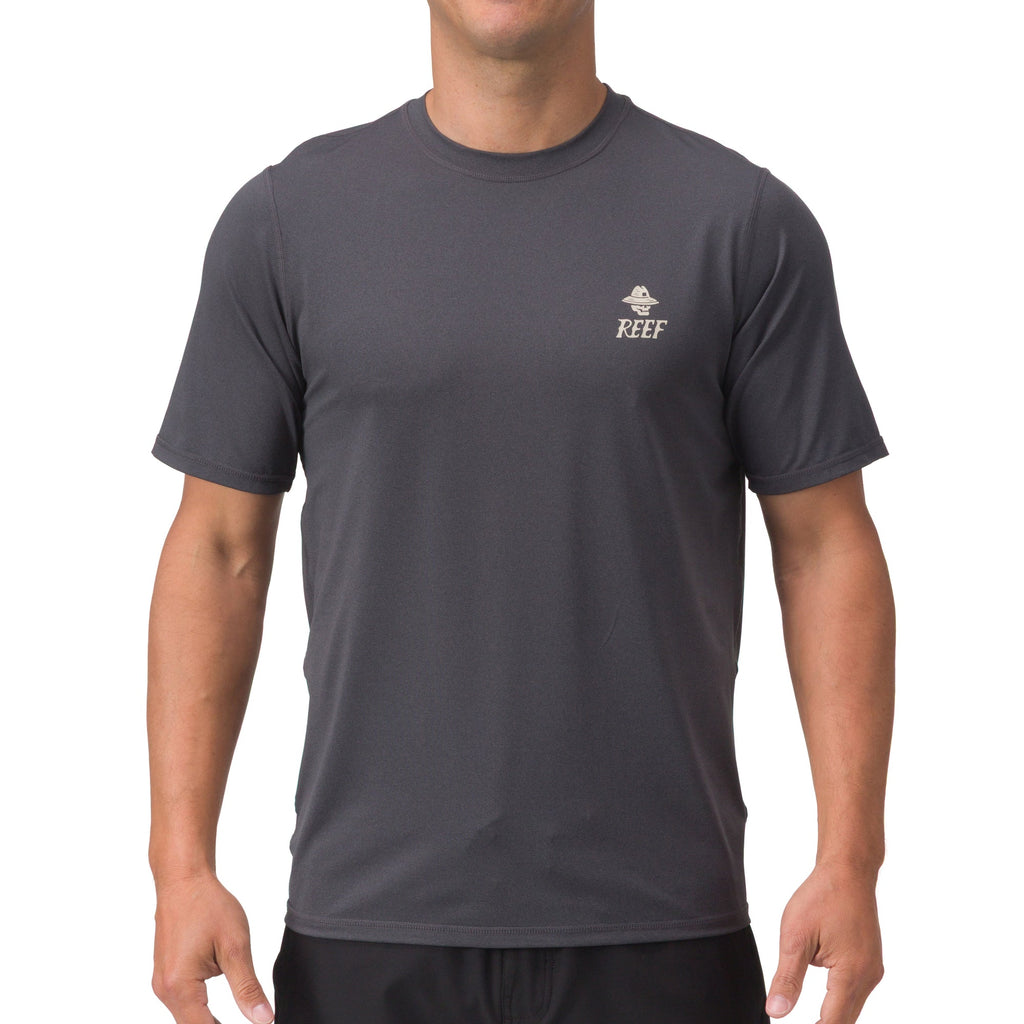 Front view of a man wearing a charcoal gray Siesta Performance Shirt, surf-inspired comfort apparel for men.