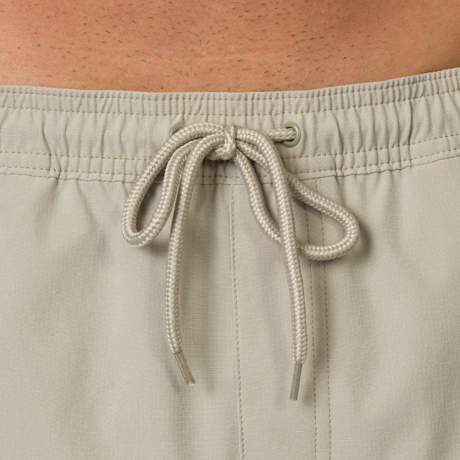Close-up of the waistband and drawstring of the men's Rushmore Hybrid Short in beige, surf-inspired and comfortable.