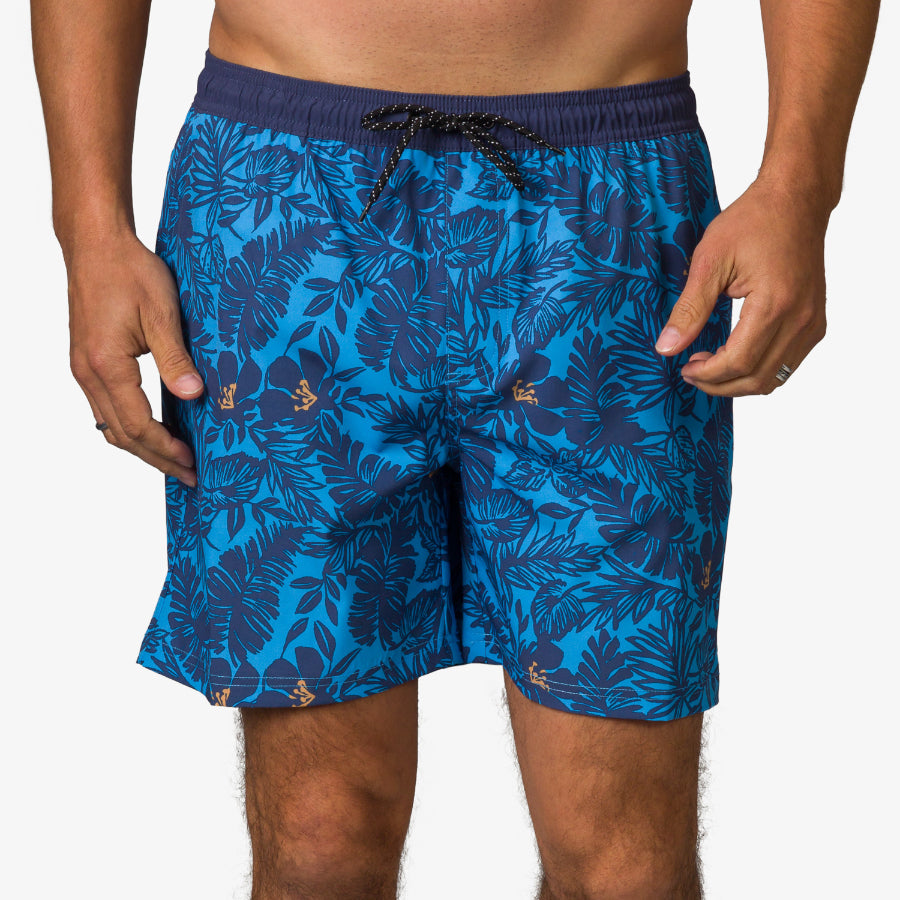 Front view of men's Felix Boardshort in blue with navy tropical leaf print and drawstring waist, beach-inspired comfort design.