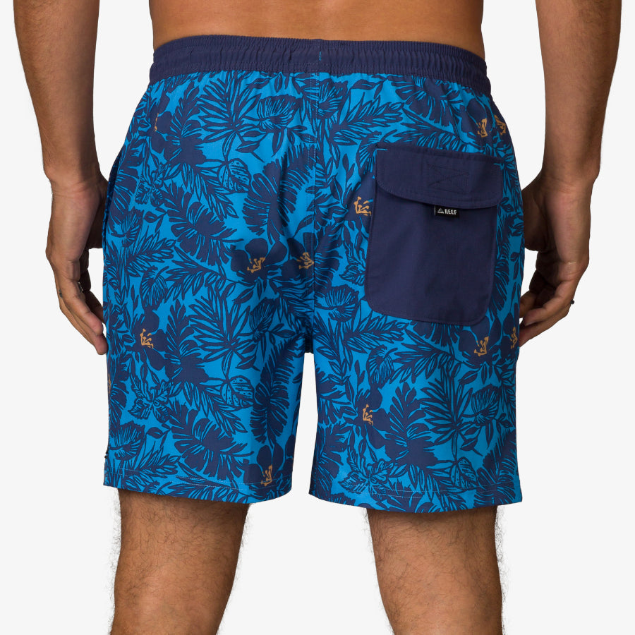 Men wearing blue Felix Boardshort facing backward, showing back pocket with flap, beach-inspired comfort design.