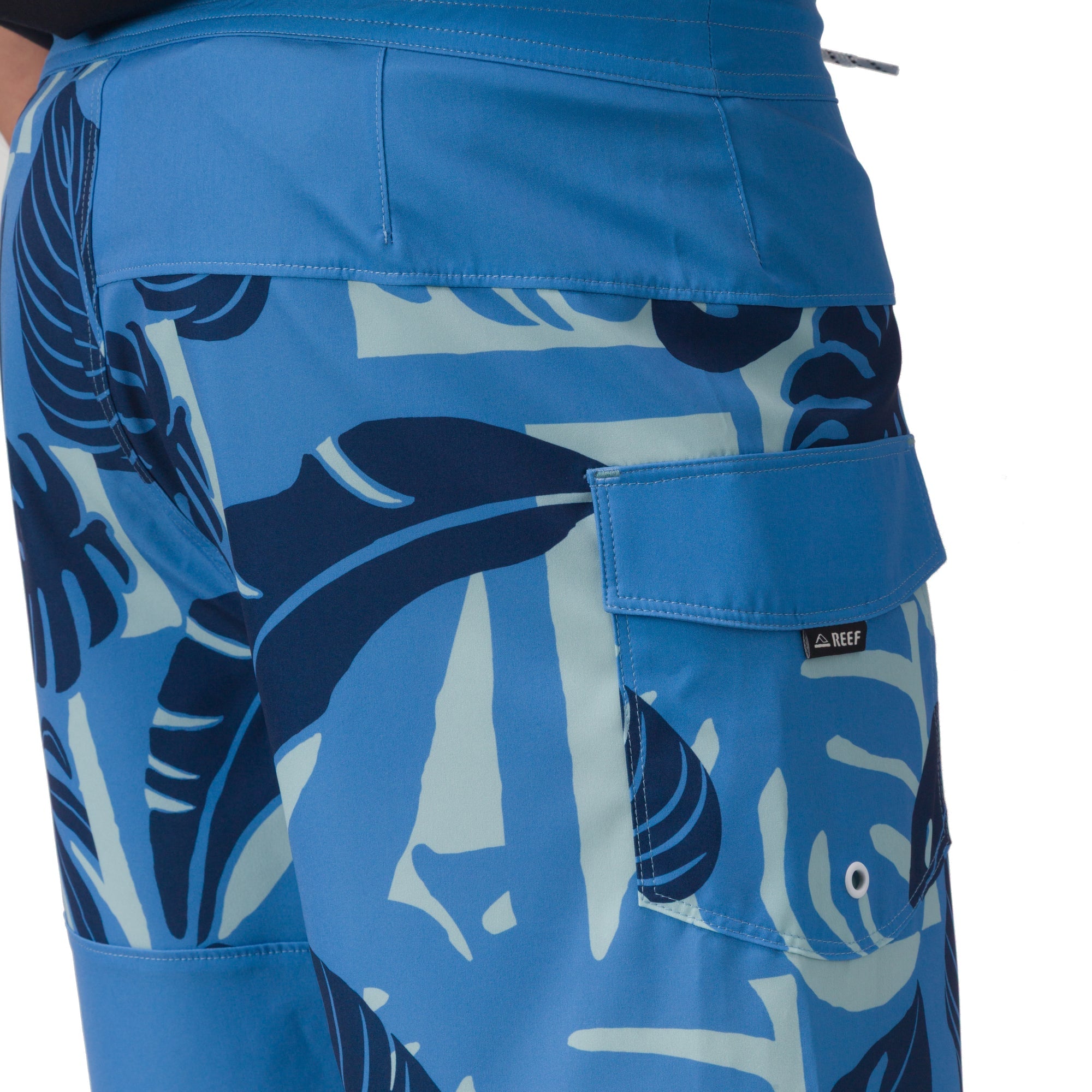 Close-up side view of men's Gonzo Boardshort in blue with navy leaf print and cargo pocket, surf-inspired comfort design.