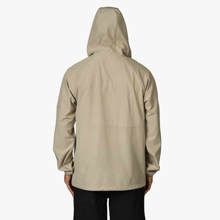 Back view of men’s Garvey Jacket in neutral beige with hood, surf-inspired comfort and durable beach-ready design.