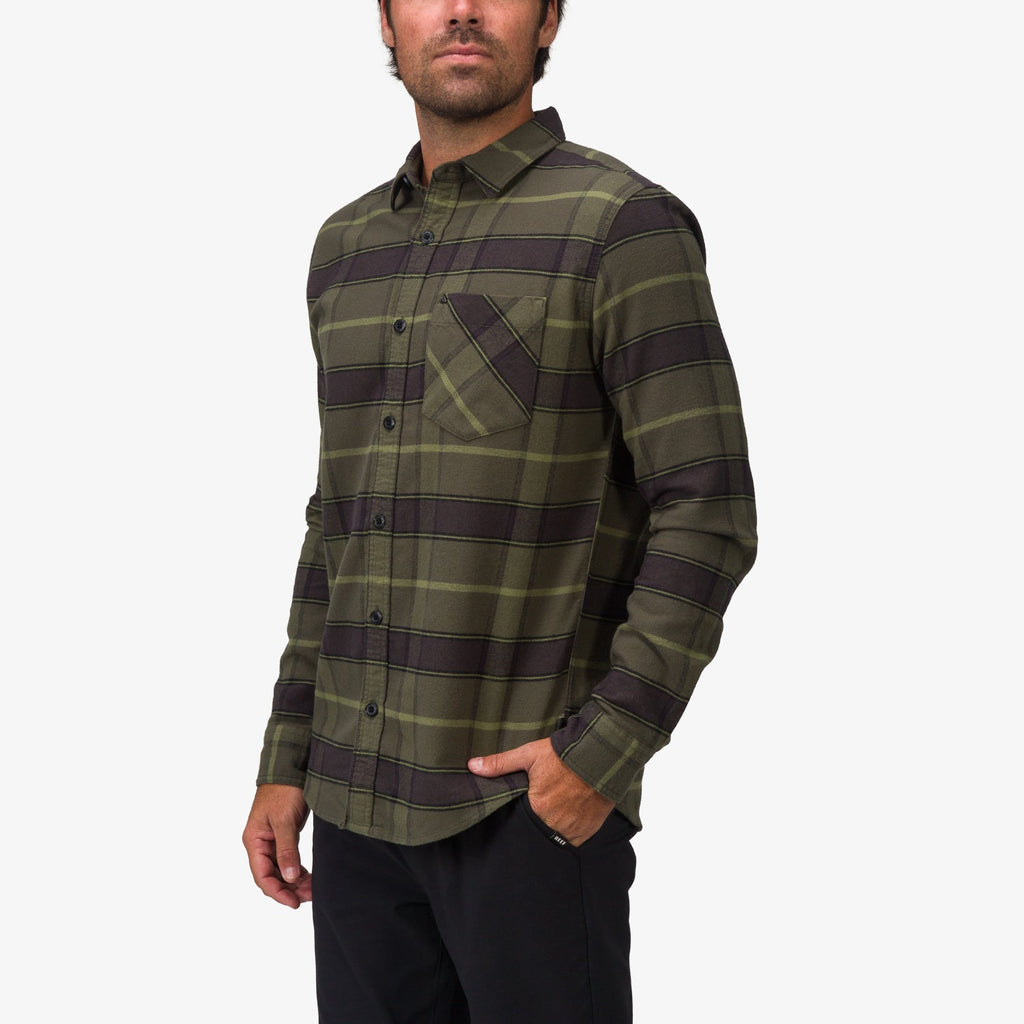 Man wearing Anders Long Sleeve Woven Shirt in olive plaid, front left side view, styled for casual beach comfort apparel.