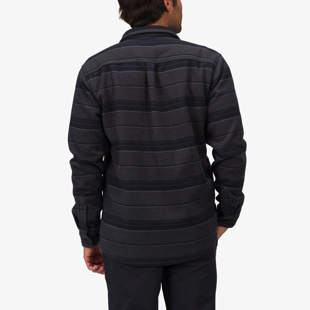 Man wearing Bartlett Woven Jacket showing back view, made with durable, comfortable beach-inspired fabric for everyday wear.