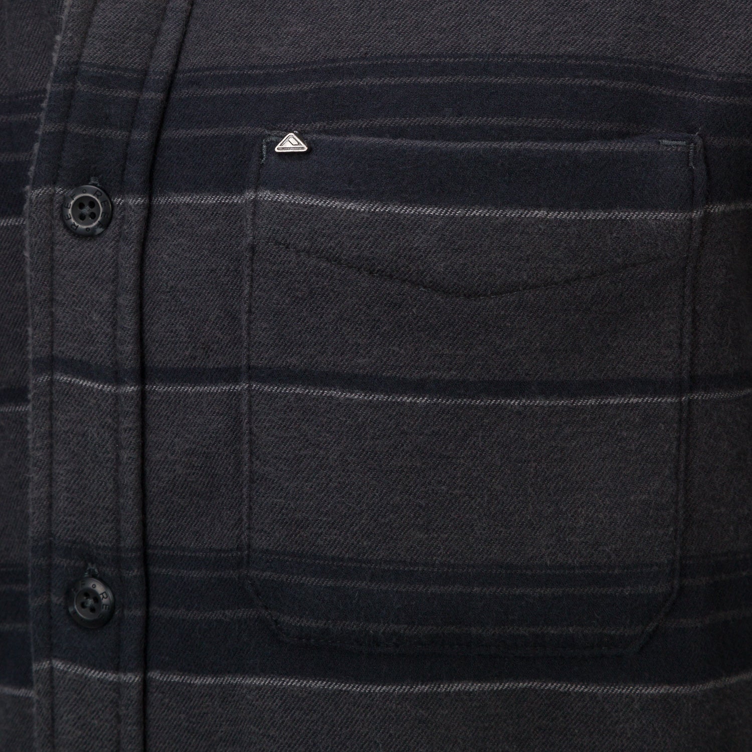 Close-up of the chest pocket on the Bartlett Woven Jacket, featuring soft, durable, beach-inspired apparel fabric.