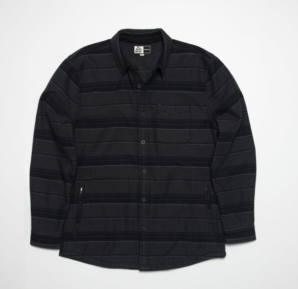 Front view of the Bartlett Woven Jacket in black with subtle stripes, featuring a button-up design and collar.