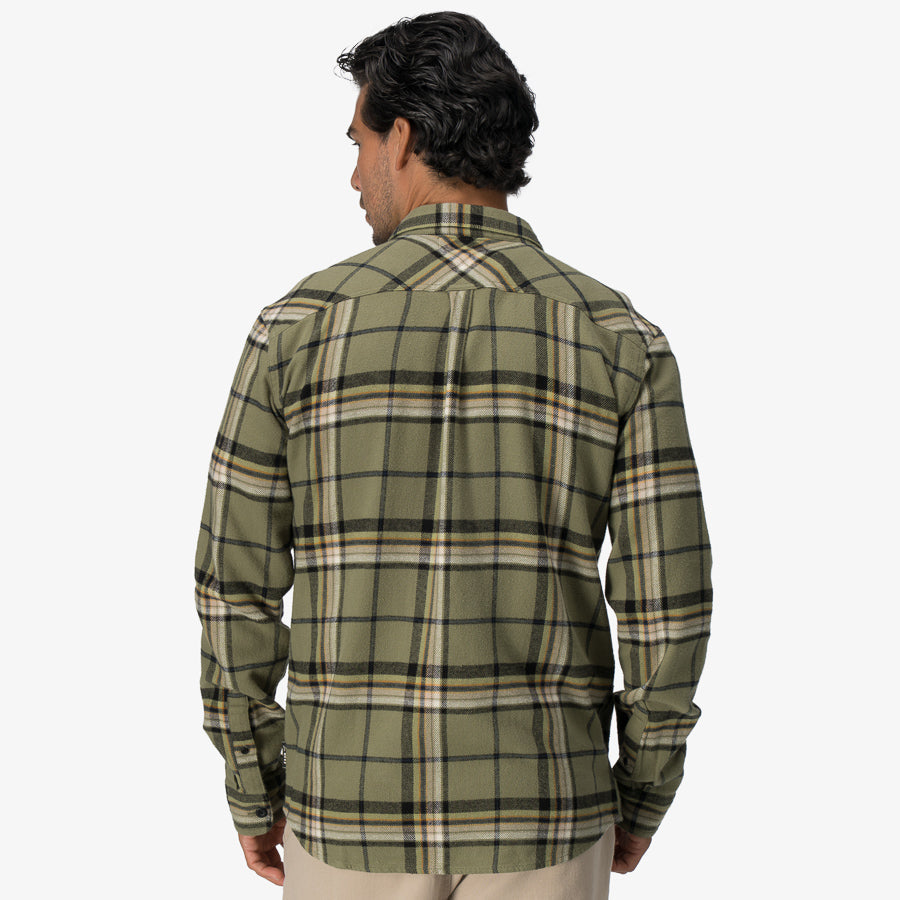 Men's Dyson Flannel Shirt in green plaid shown from the back, highlighting comfort and casual surf-inspired apparel.