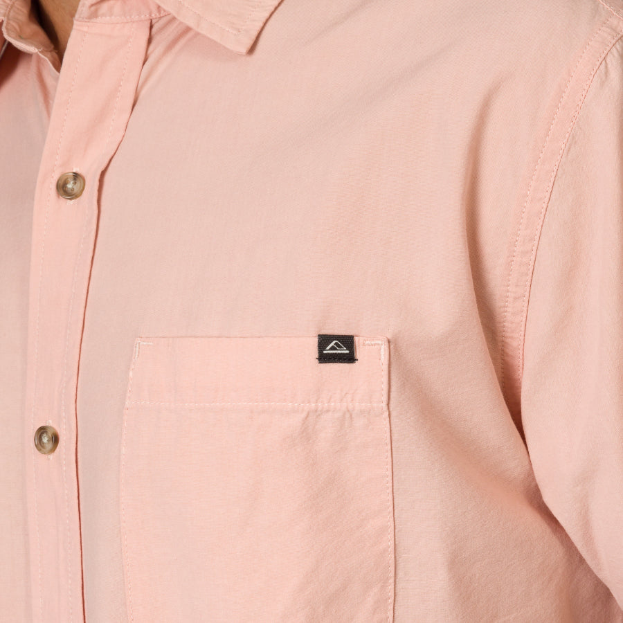 Close-up of the chest pocket on the Collins Ss Woven Shirt in soft pink, highlighting comfort and quality stitching.