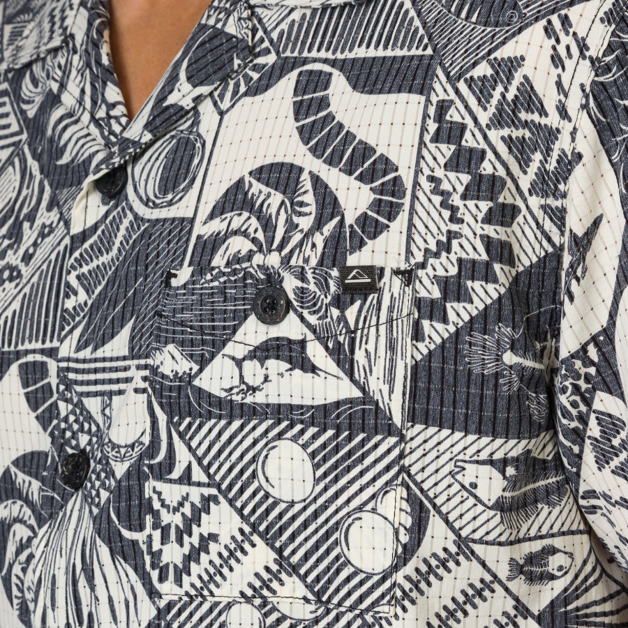 Close-up of the Beckham Camp Shirt showing textured black and white patterned fabric with button details for men’s beachwear