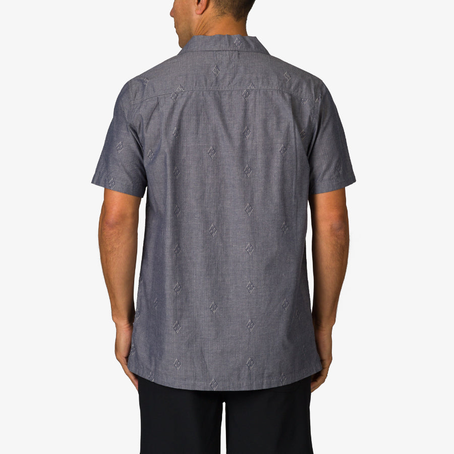 Man wearing a grey Harold Camp Shirt shown from the back, highlighting its relaxed beach-inspired fit and comfort design.