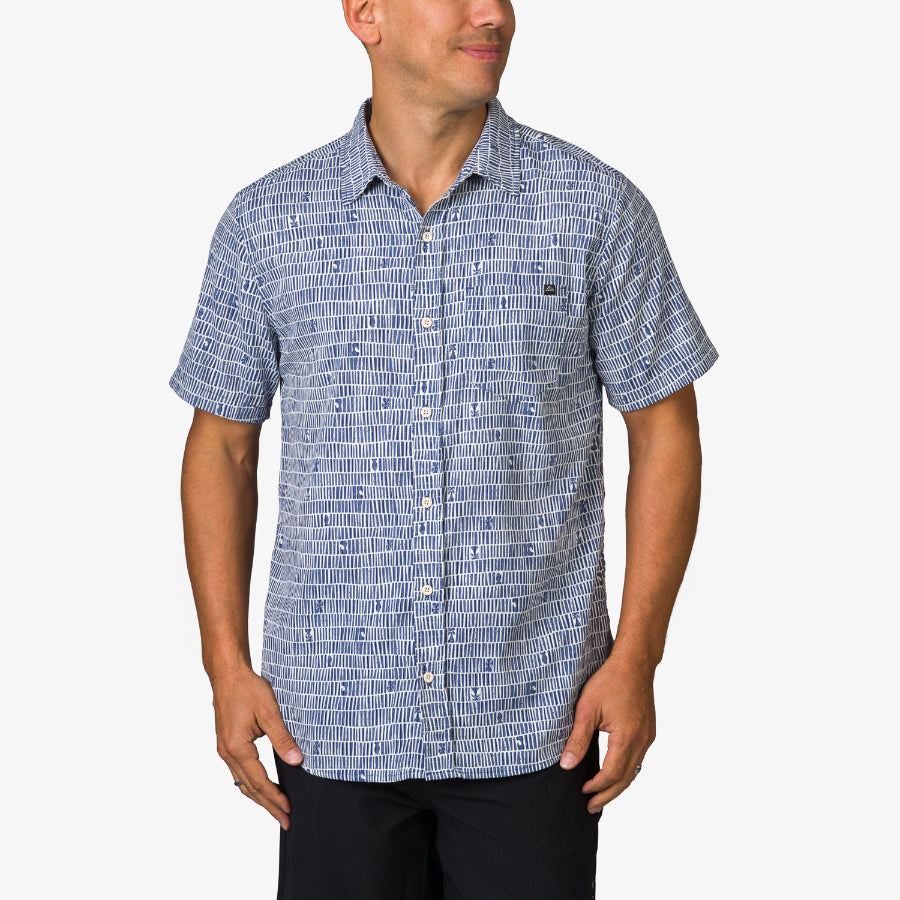 Man wearing a blue patterned Ferris Classic Shirt facing forward, showcasing the short sleeves and button-down front.