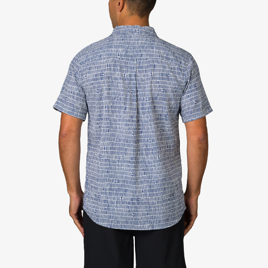 Back view of a man wearing the blue patterned Ferris Classic Shirt, showcasing its beach-inspired men's apparel design.