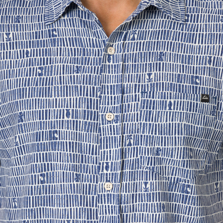 Close-up of the chest area of the Ferris Classic Shirt in blue patterned fabric with button closure and surf-inspired design.