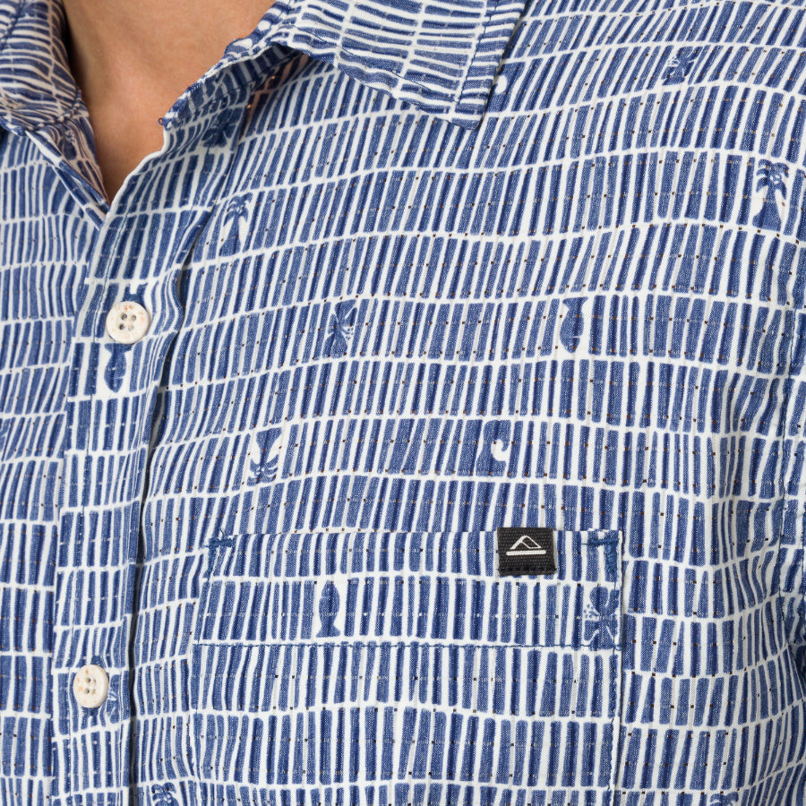 Close-up of men's Ferris Classic Shirt pocket and upper chest in blue patterned beach-inspired fabric showing button details.
