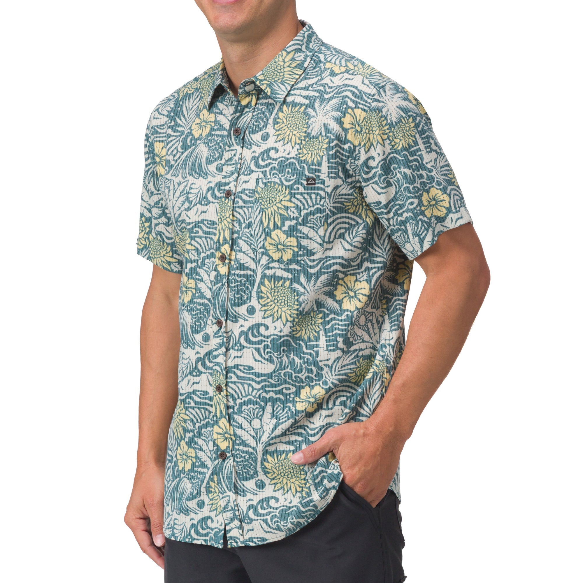 Men wearing Eugene Woven Shirt in blue floral pattern, shown from front with hand in pocket, beach-inspired comfort apparel.