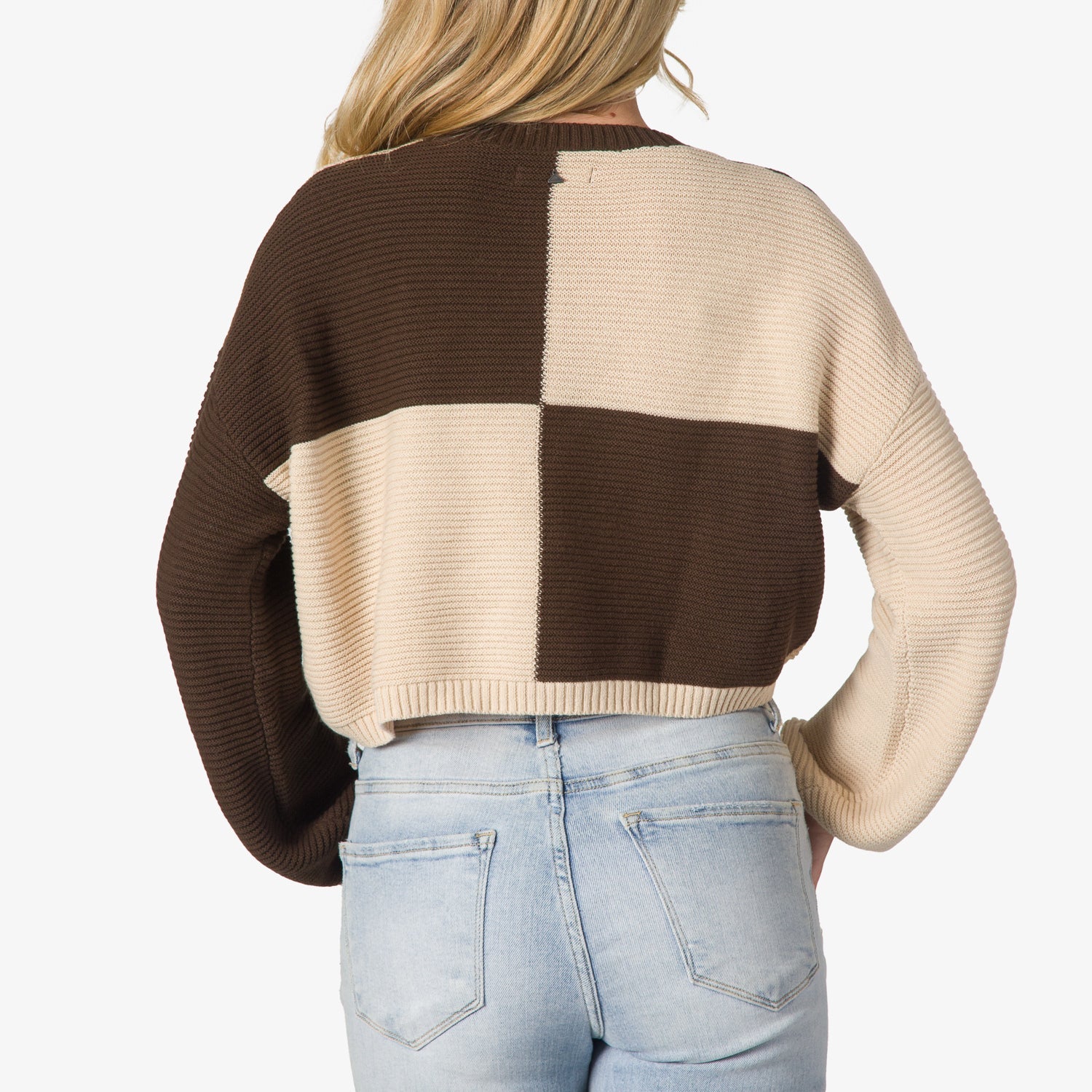 Back view of Carrie Sweater in brown and beige blocks, showing textured knit and relaxed fit for beach-inspired comfort.