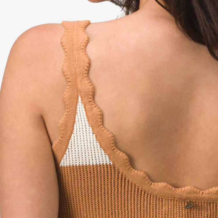 Close-up of back shoulder strap detail on the women's Gia Maxi Dress in textured tan fabric with scalloped edges