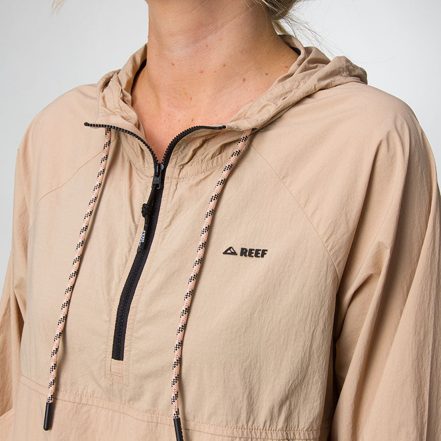 Close-up of a beige Anorak Hoodie for women, front-facing with zip and hood, surf-inspired comfort apparel by REEF.