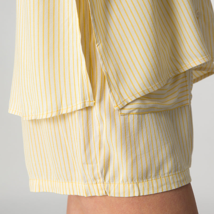 Ellie Short close-up side view showing lightweight, striped yellow and white fabric with beach-inspired comfort design.