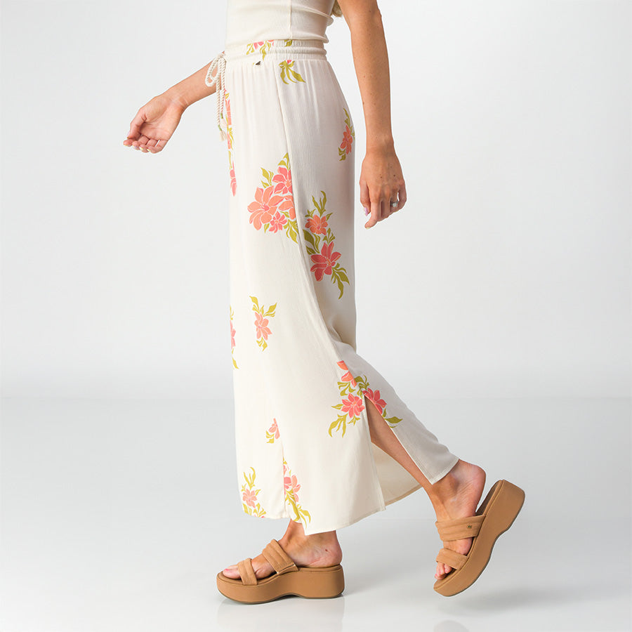 Side view of Belladona Pant in white with floral print paired with tan platform sandals facing right, showcasing comfort and style.