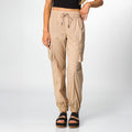 Front view of women's Cargo Jogger Pant in beige, paired with black platform sandals featuring soft-rebound cushioning.