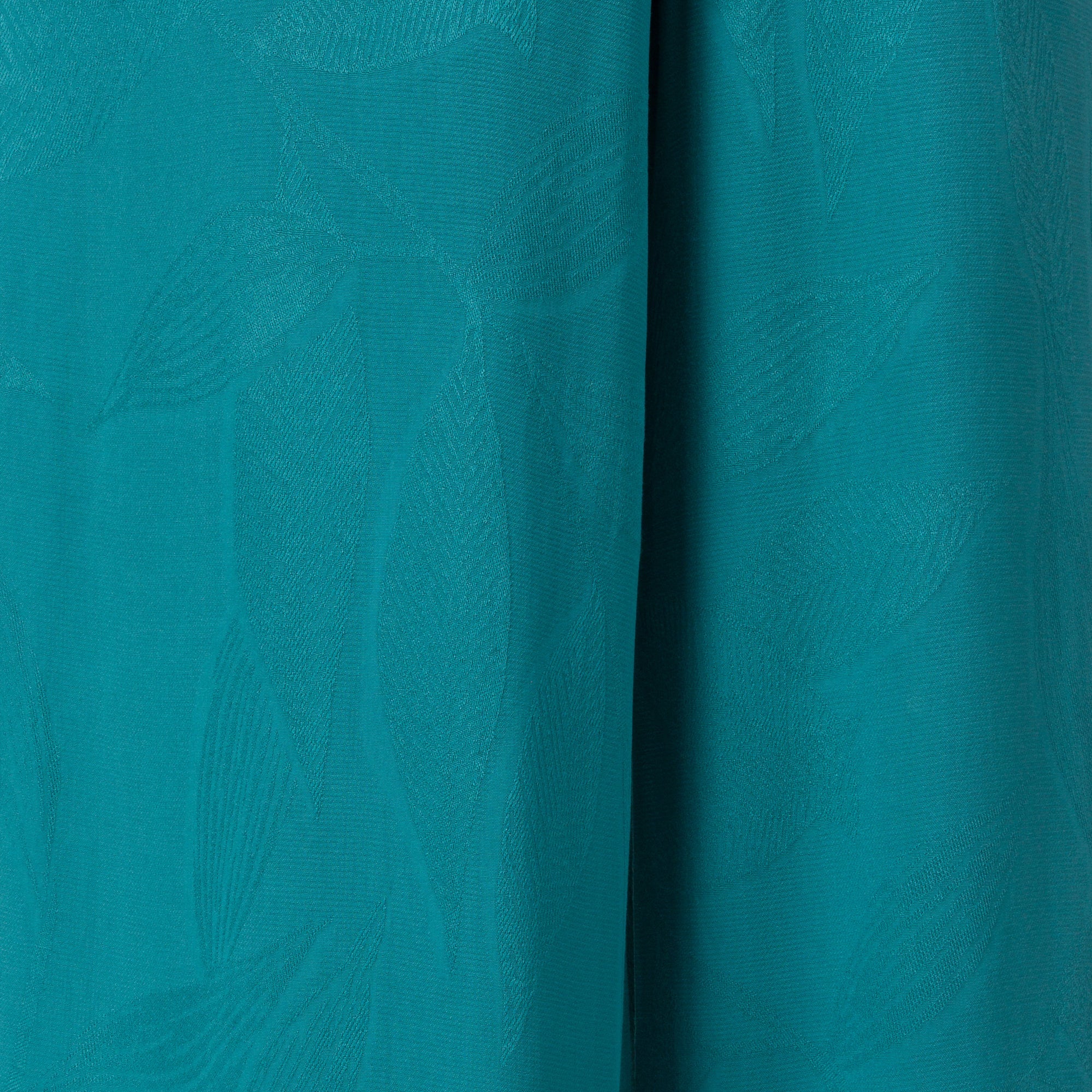Ollie Tank close-up of teal fabric texture with subtle surf-inspired pattern, designed for comfort and beach lifestyle.