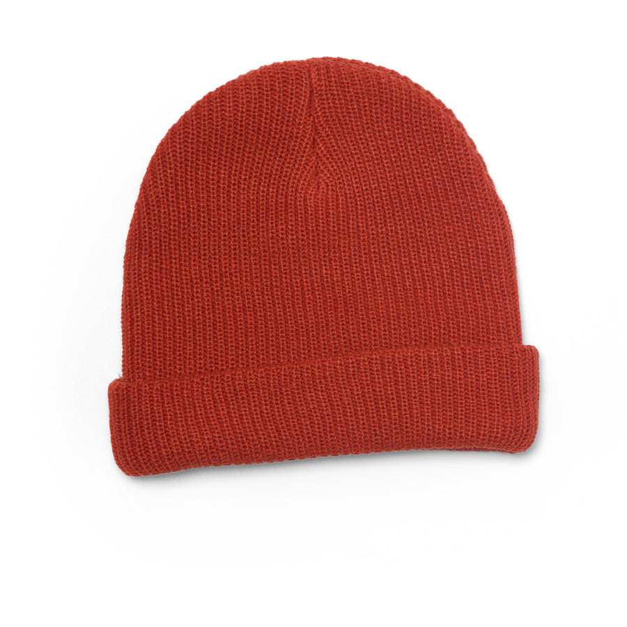 Alyx Beanie in chili red knit fabric, flat lay showing front and top, unisex surf-inspired beach apparel accessory.