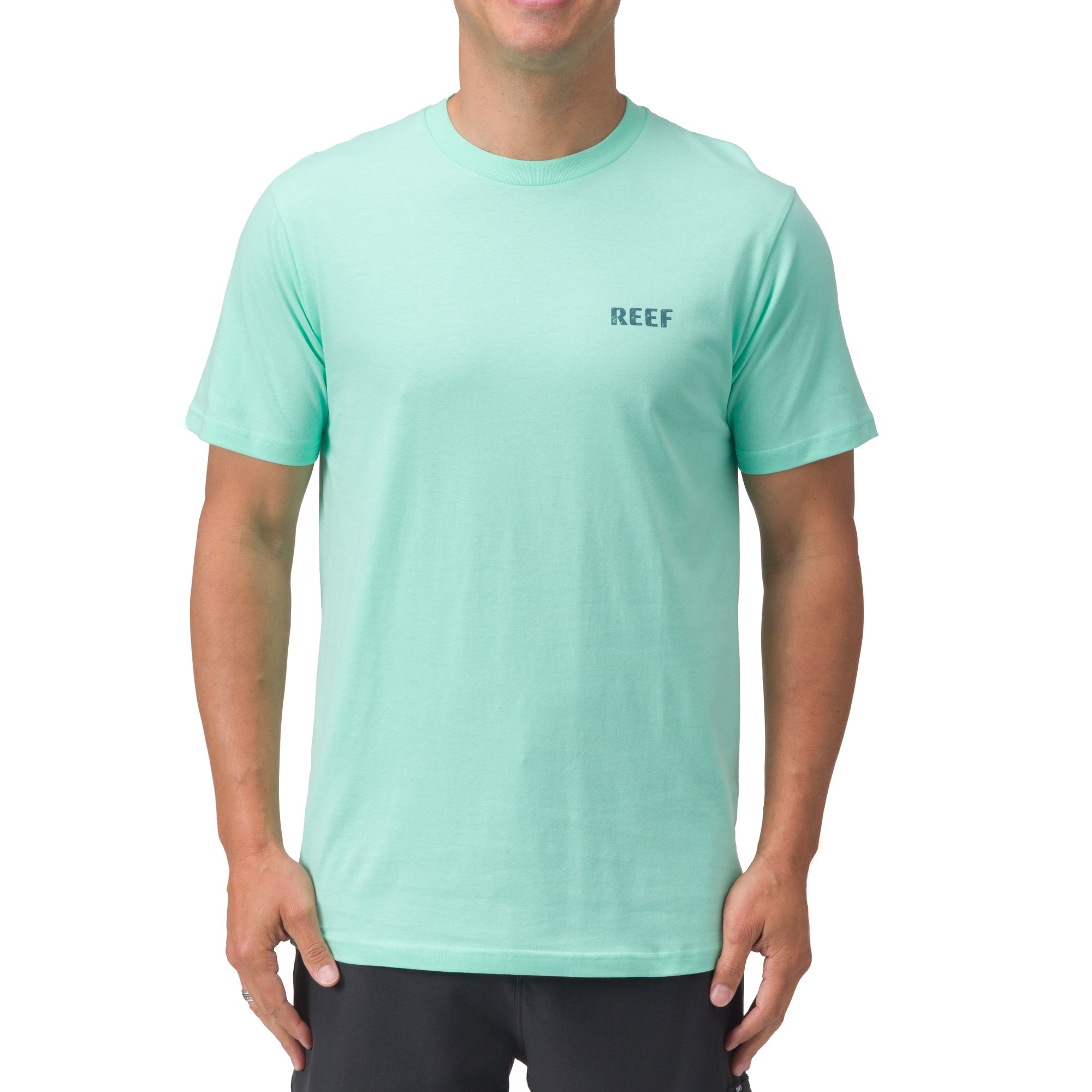 Front view of men's Wellie Too Tee in light aqua, surf-inspired comfort apparel with REEF logo on chest.