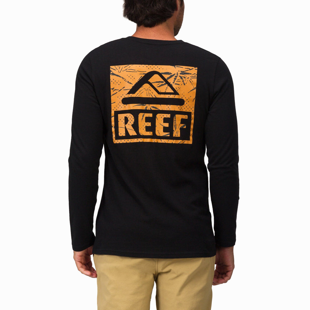 Back view of Wellie 24 Long Sleeve Tee in black with large orange REEF logo, beach-inspired, comfort-focused apparel.