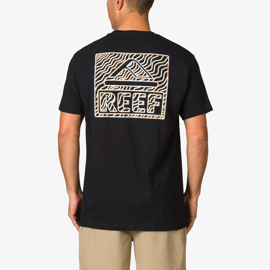 Man wearing a black Strings Tee showing back with REEF logo and wave design, beach-inspired comfort apparel for men.