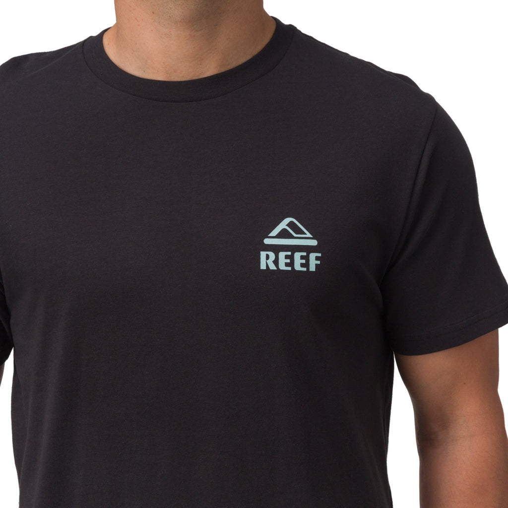 Men's black Shells Tee with blue REEF logo on left chest, surf-inspired comfortable apparel for beach lifestyles