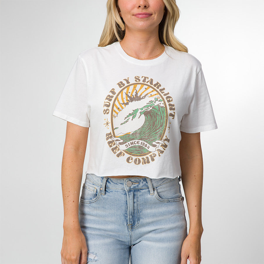 Woman wearing a white Night Surf Crop Crew Tee with vintage surf graphic, front view, casual and beach-inspired apparel.