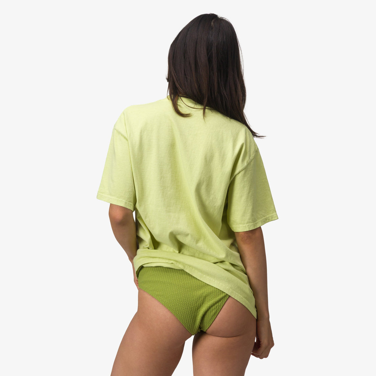Woman wearing Lost Girls Boyfriend Crew tee facing away, showcasing relaxed fit and beach-inspired casual comfort design.