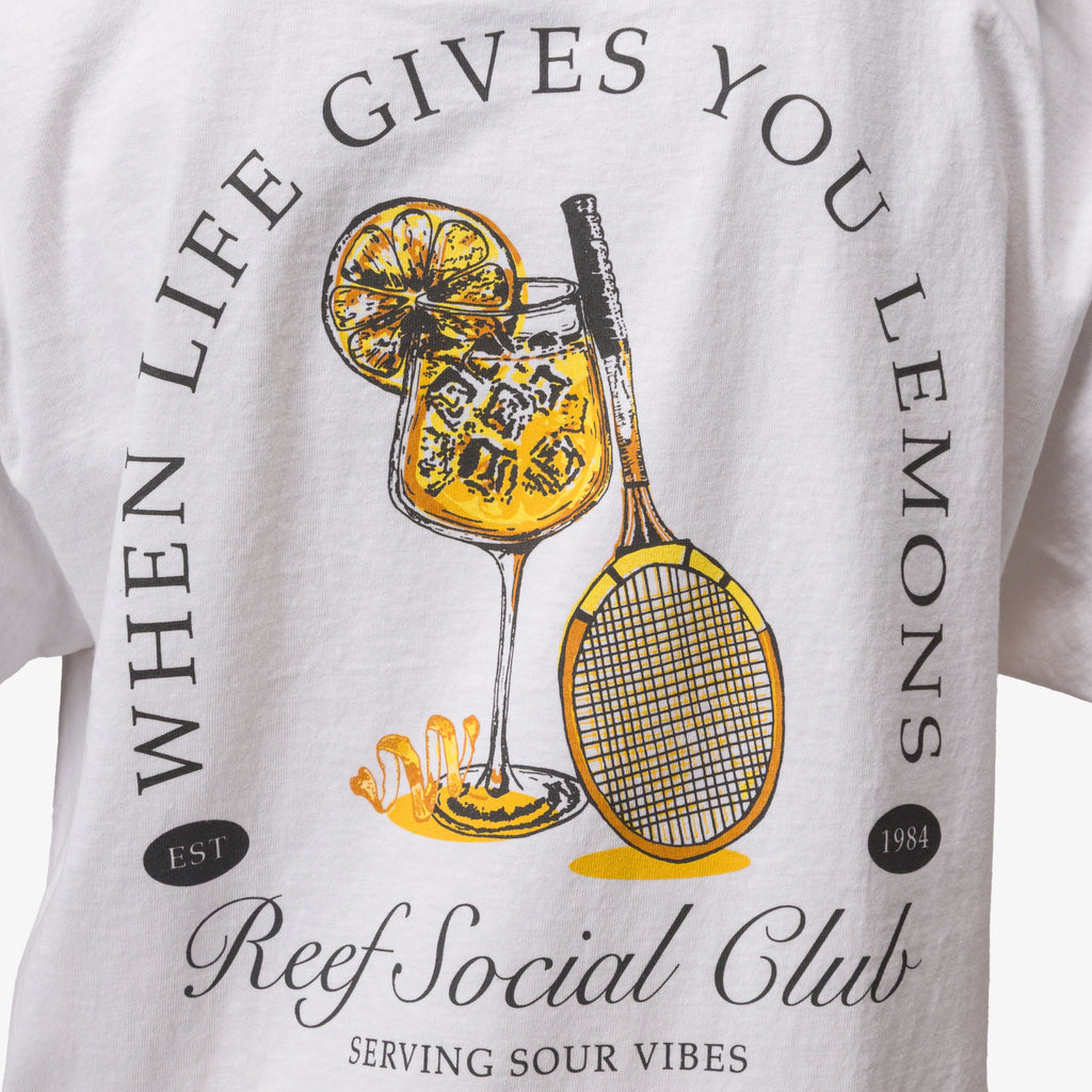 Close-up of the Social Boyfriend Crew tee’s back graphic with lemon drink and tennis racquet, surf-inspired comfort style.