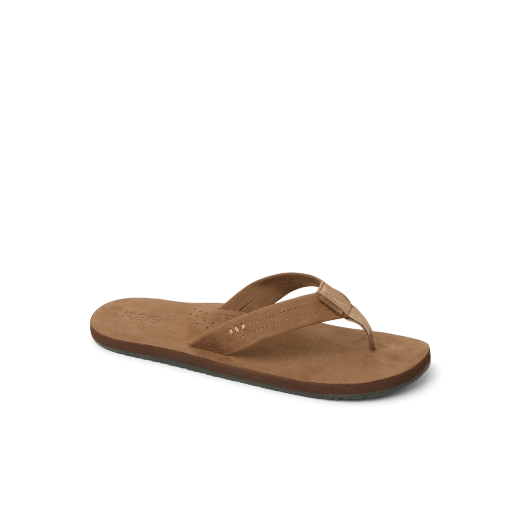 Reef Draftsmen men's brown sandal facing left, close-up on cushioned footbed with arch support for beach comfort