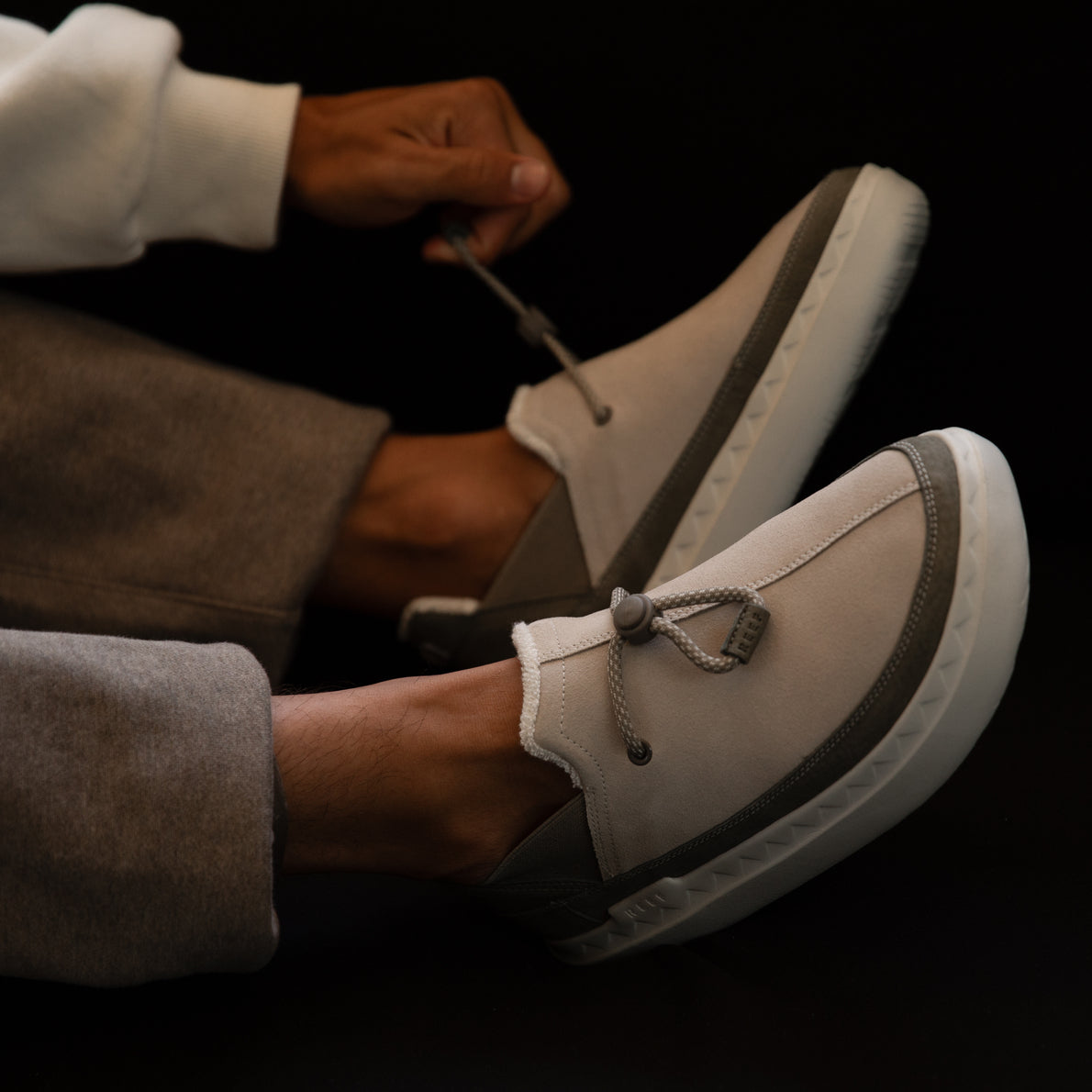 Side view of men's Rambler shoe in oatmeal with adjustable laces, showcasing comfort and durable water-friendly design