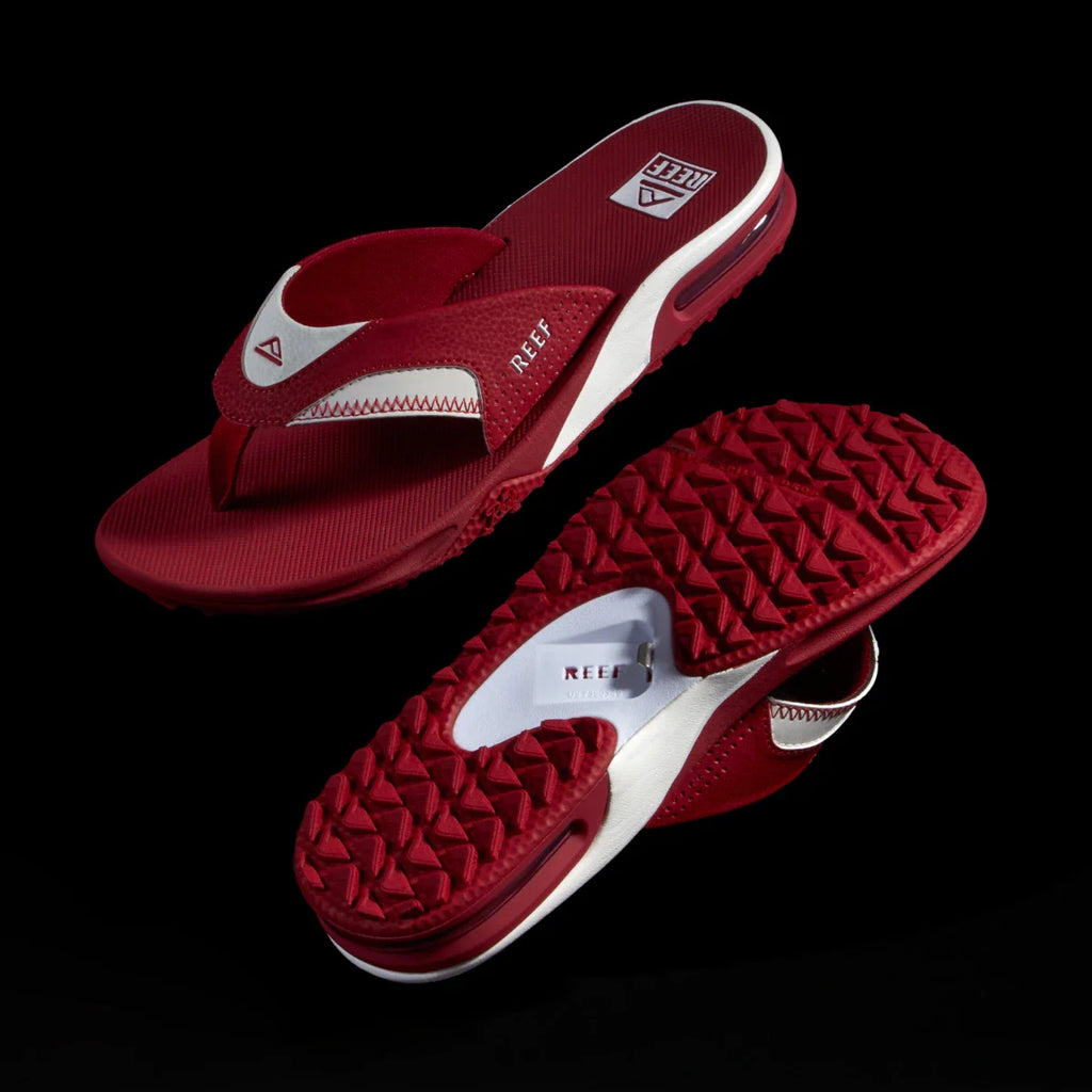 Fanning Pregame men's red and white flip flops, top view of right shoe facing left and sole view of left shoe facing right, comfort-focused design.