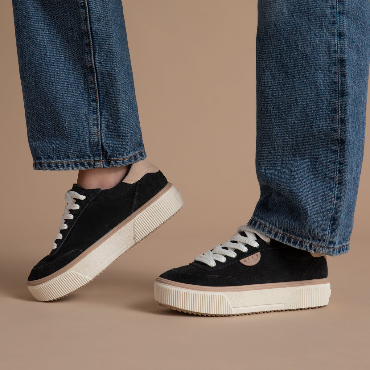 Lay Day Lift women's black platform sneakers facing right and left, surf-inspired comfort with arch support.