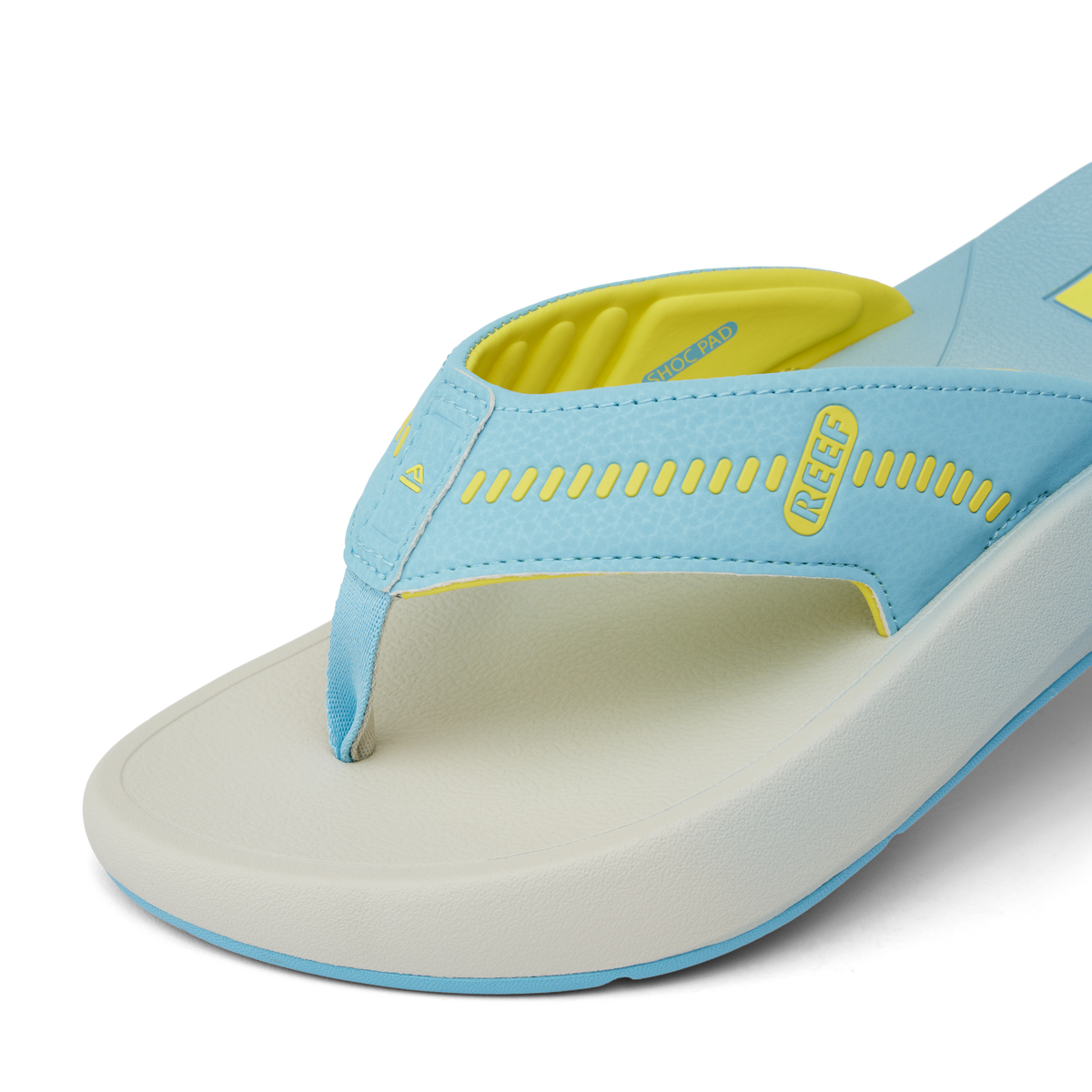 Close-up of the front right side of the Cruiser sandal in light blue and yellow showing soft-rebound cushioning and anatomical arch support.