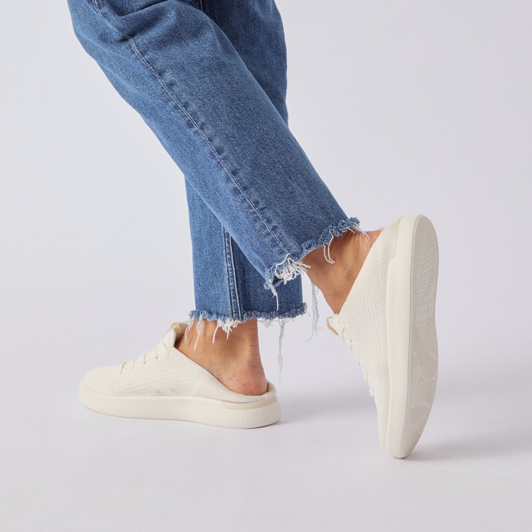 Reef Neptune women's cream knit sneaker facing left, showcasing lightweight, cushioned comfort and anatomical arch support.