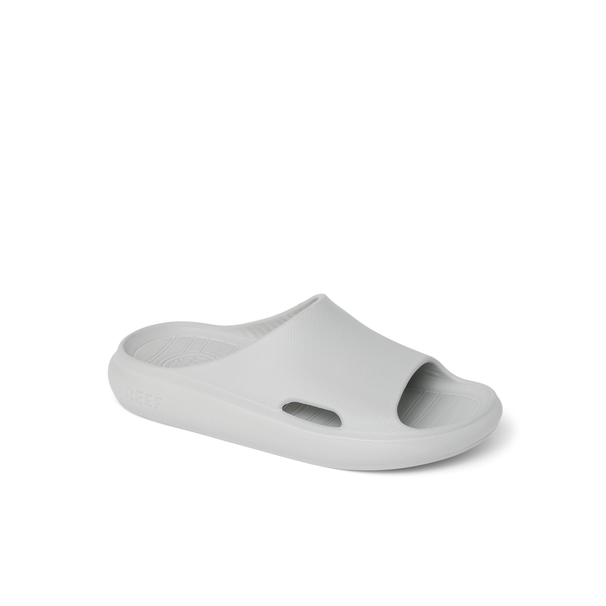 Kids Rio Slide in light grey facing right, close-up of front and side, breathable, water-friendly, cushioned slides for kids.