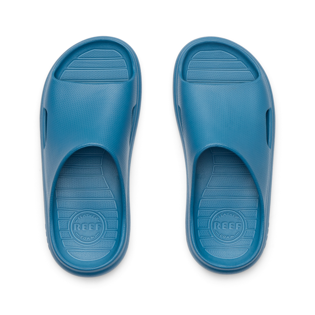 Top-down view of blue Kids Rio Slide facing upward, showing soft-rebound cushioning and anatomical arch support.