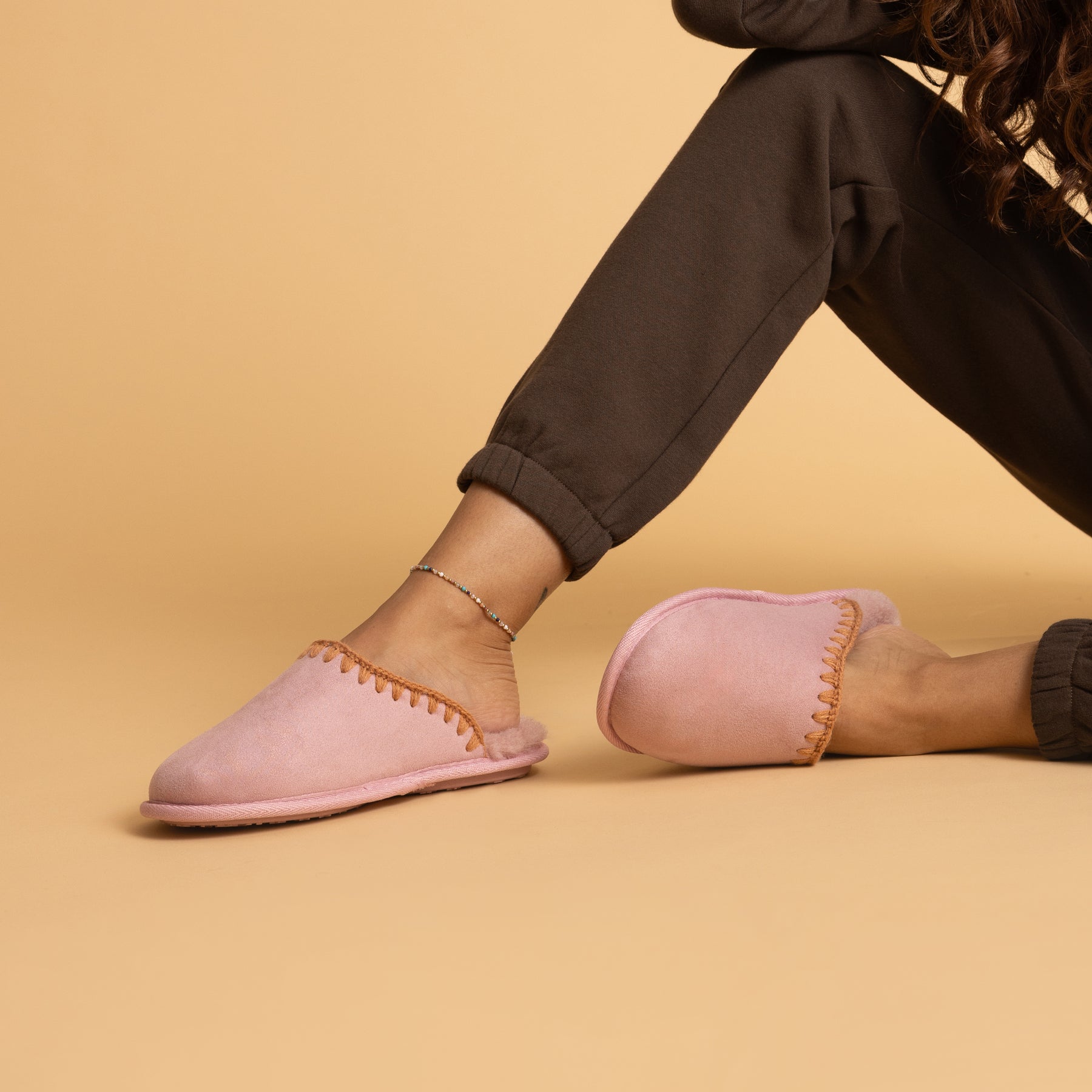 Iryss women’s pink slip-on slippers facing left, close-up of side and top views with soft cushioning and arch support