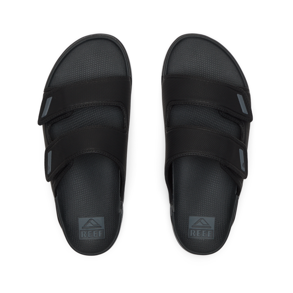 Top view of black Phantom Tradewind men's sandals with dual straps, soft cushioning, and anatomical arch support for beach comfort.