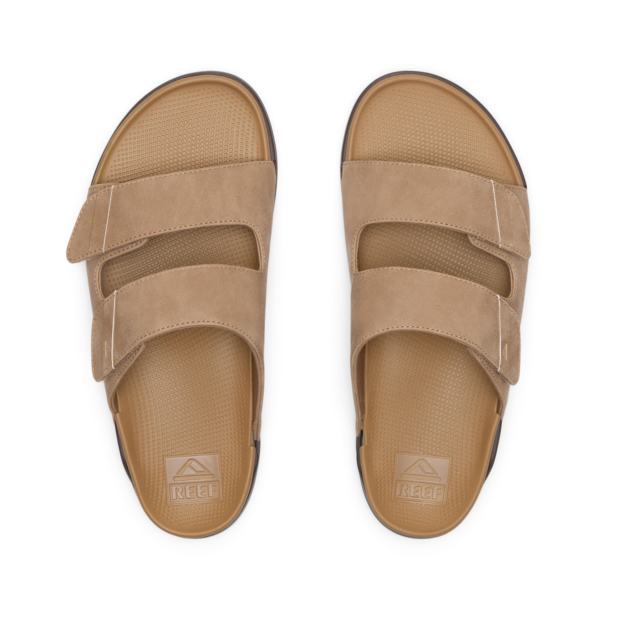 Phantom Tradewind men's tan sandals facing up, showing top straps and textured footbeds with anatomical arch support.