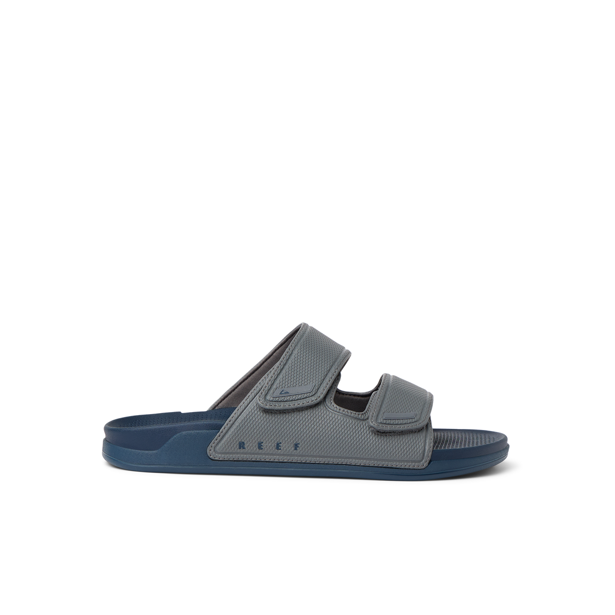 Phantom Tradewind men's sandal facing right, blue-grey, with adjustable straps and cushioned arch support.