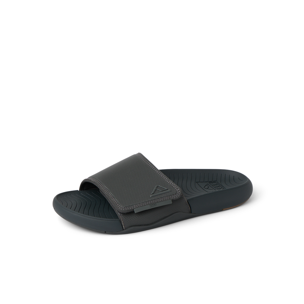 Men's Phantom Slab slide facing left, black water-friendly sandal with cushioned, arch-support footbed close-up.
