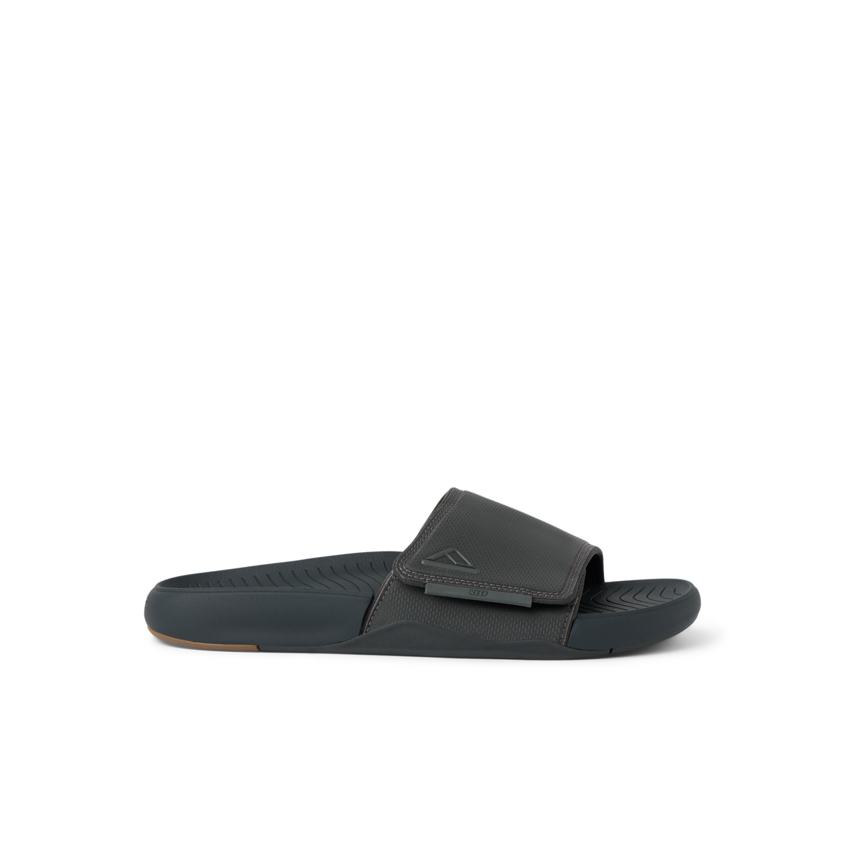 Side view of a black Phantom Slab men’s slide sandal featuring anatomical arch support and soft cushioning for beach comfort
